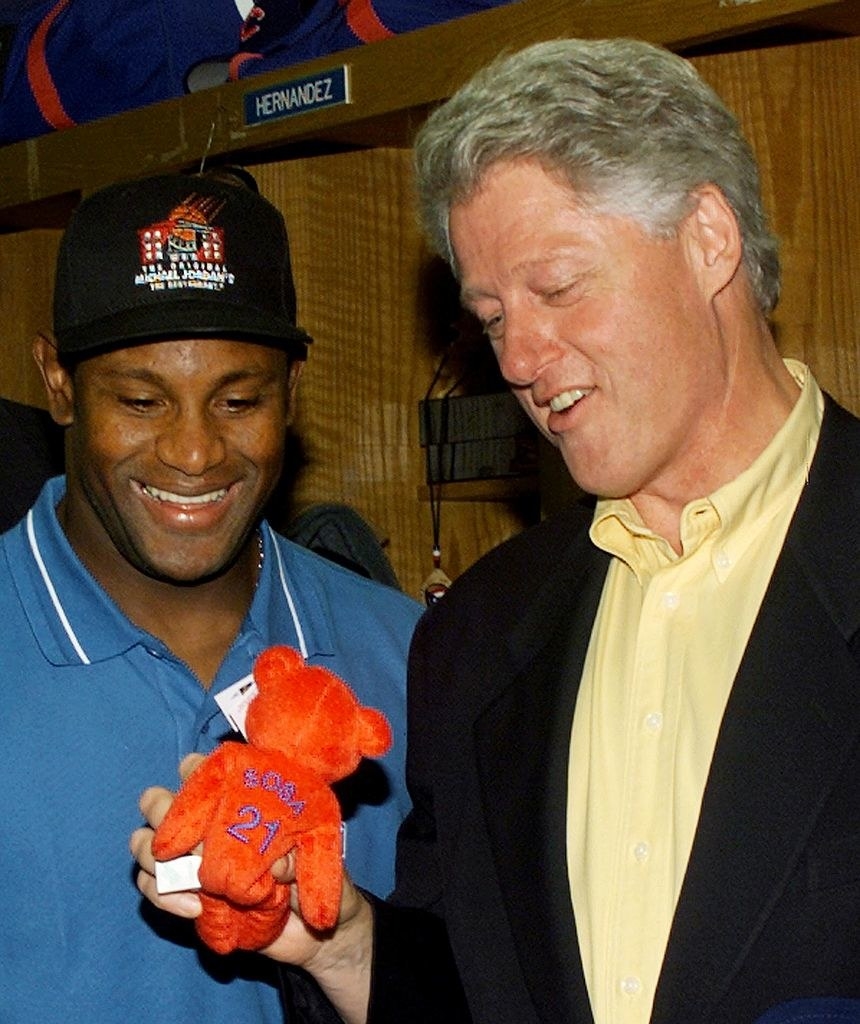 Bill Clinton and Sammy Sosa with a red Beanie