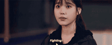 a woman saying &quot;fighting&quot;