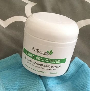 reviewer photo of the tub of foot cream