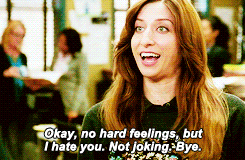 Chelsea Peretti as Gina Linetti smiles before turning around and walking away as she says