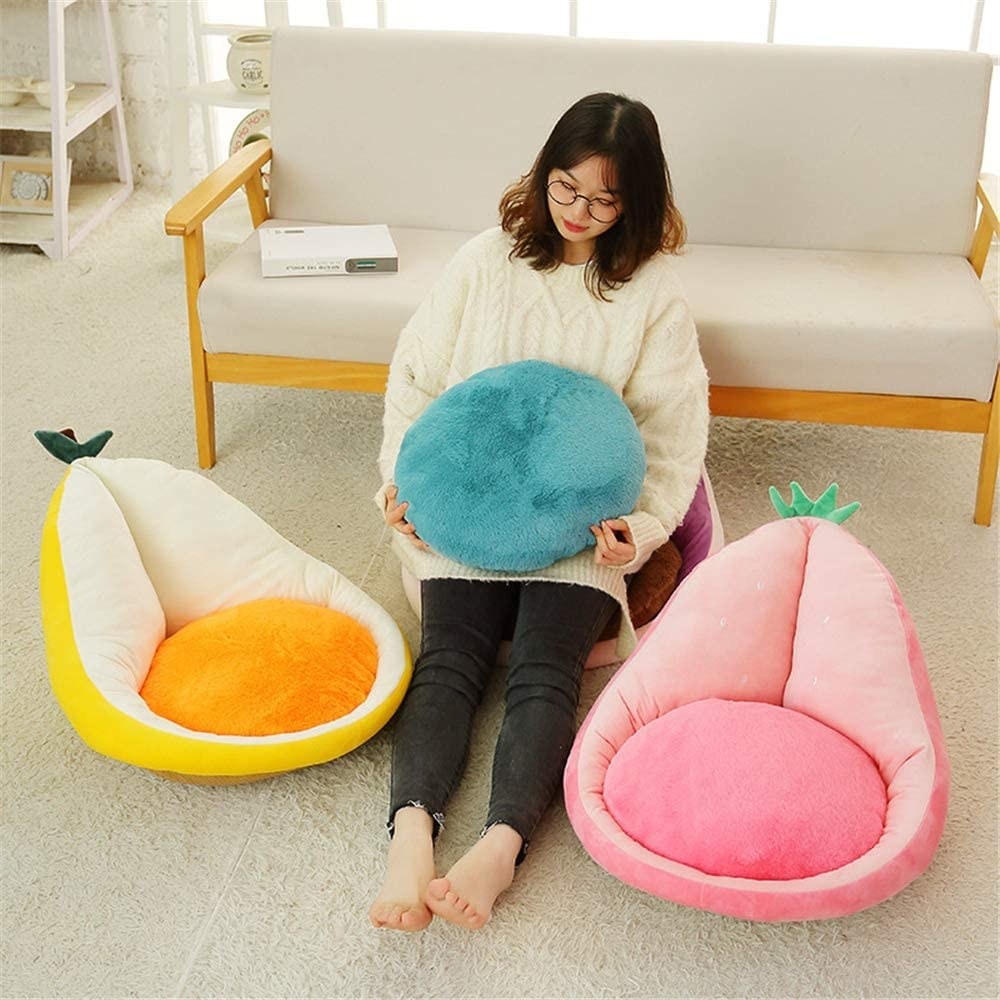 small pillows with backs shaped like lemon and strawberry