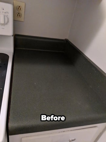 a reviewer photo of a gray kitchen countertop labeled 