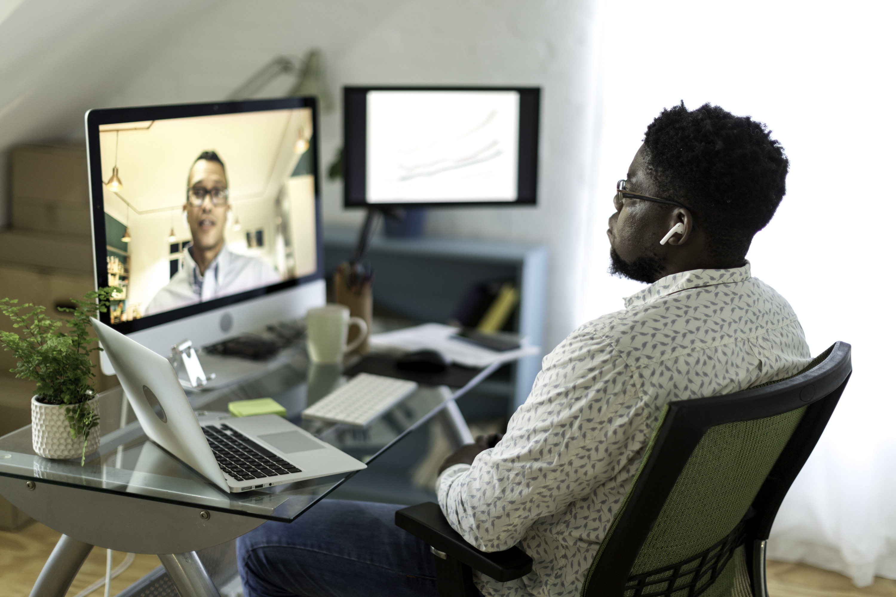 Man on a video call with a coworker