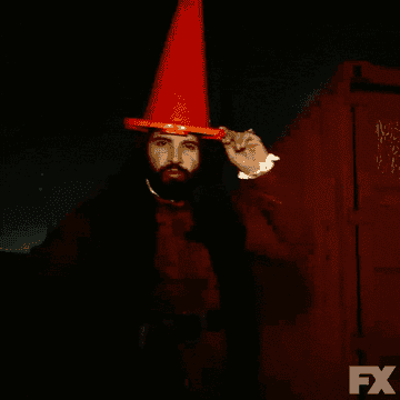 Nandor wears a traffic cone on his head and says he's a wizard