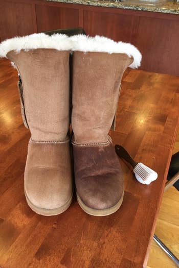 a reviewer shows Uggs after using the brush