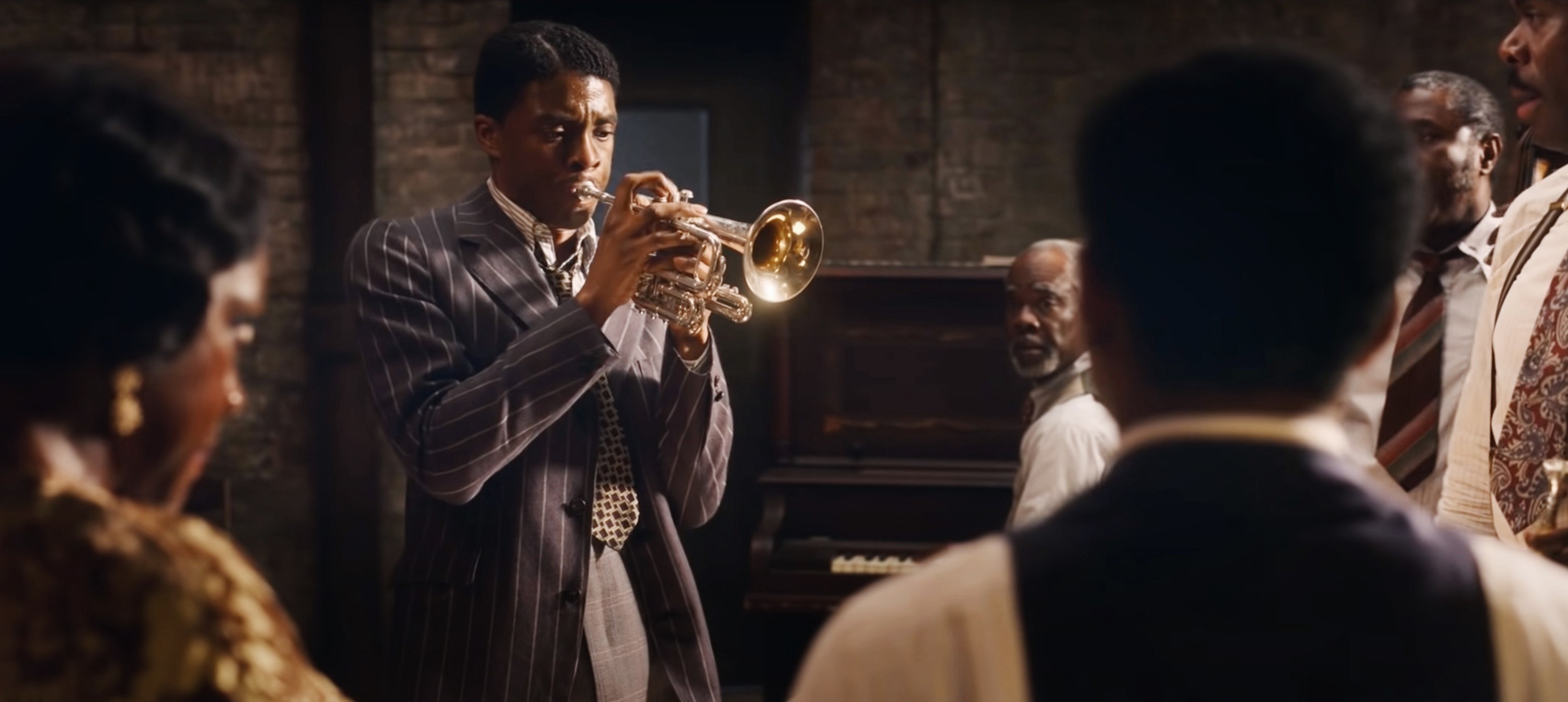 Boseman plays the trumpet