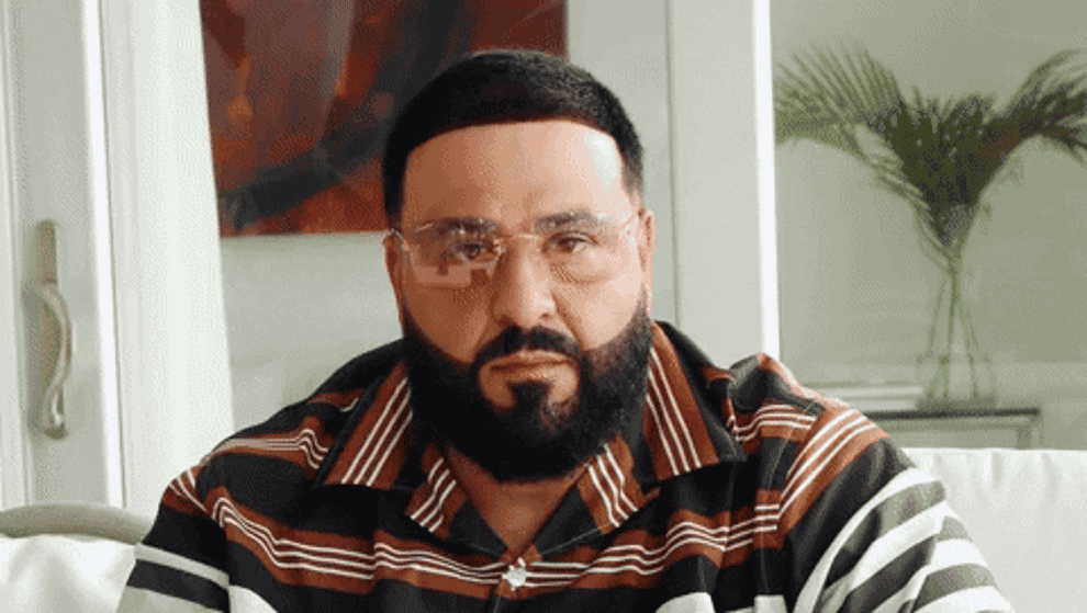 DJ Khaled taking off his sunglasses and nodding his head in agreement