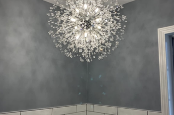 closeup of reviewer's light in a bathroom