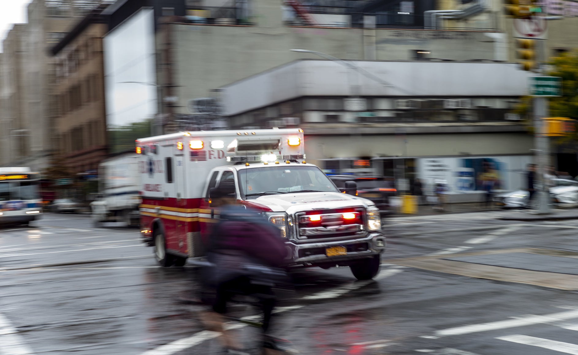 Ambulance driving through the city with its emergency lights on