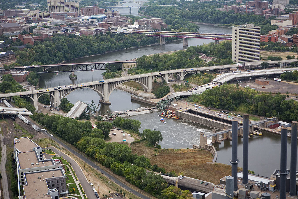 An aerial view shows the collapsed I-35W bridge 04 August 2007 in Minneapolis, Minnesota