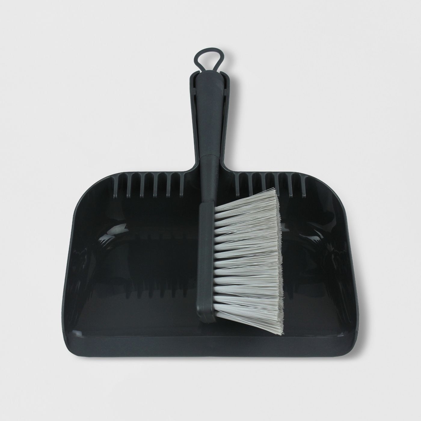 the black hand broom and dustpan