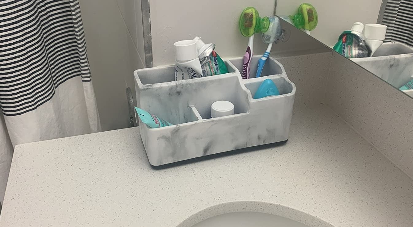 reviewer image of the 5-slot organizer on a bathroom vanity