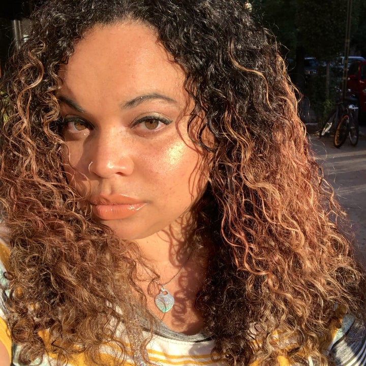 BuzzFeed editor wearing gold shimmery highlight