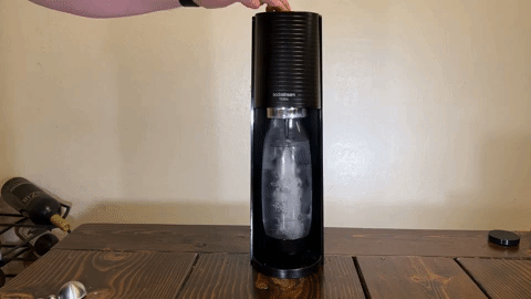 Reviewer gif of them using the SodaStream