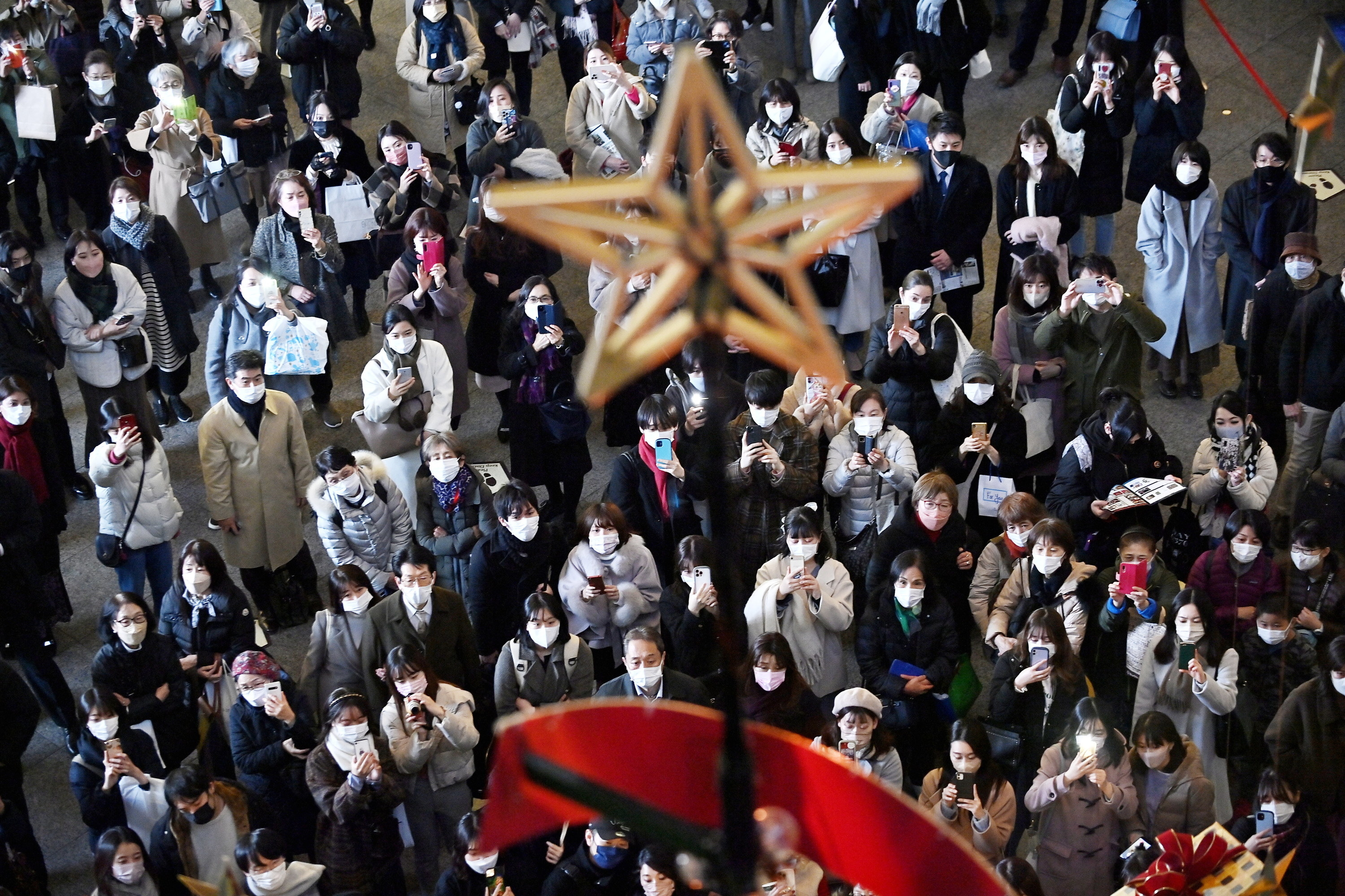 People wearing masks during a holiday festival