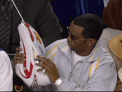 diddy using a shoe for a phone
