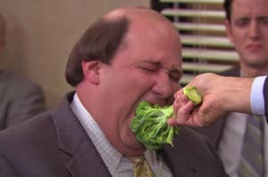 Kevin from The Office being force fed broccoli