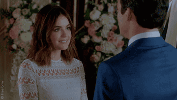 Aria and Ezra kissing at their wedding
