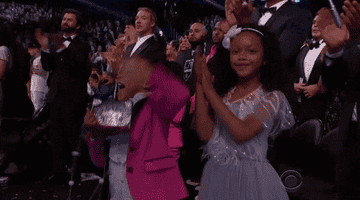 Blue jumping up and down for her mom at the Grammy's