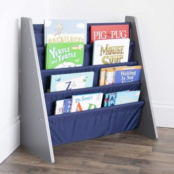 A child's book sling-style shelf lined with books
