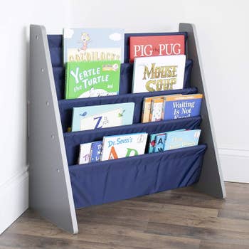 A child's book sling-style shelf lined with books