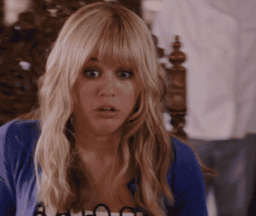 Hannah Montana leans back, appearing shocked
