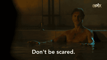 A man in a pool of water says,