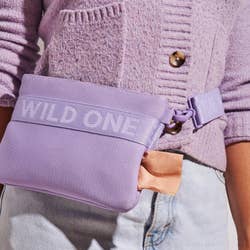 model wearing pouch with bag dispenser on the side as a fanny pack