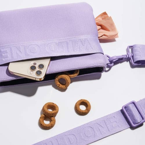 lilac bag holding treats and phone