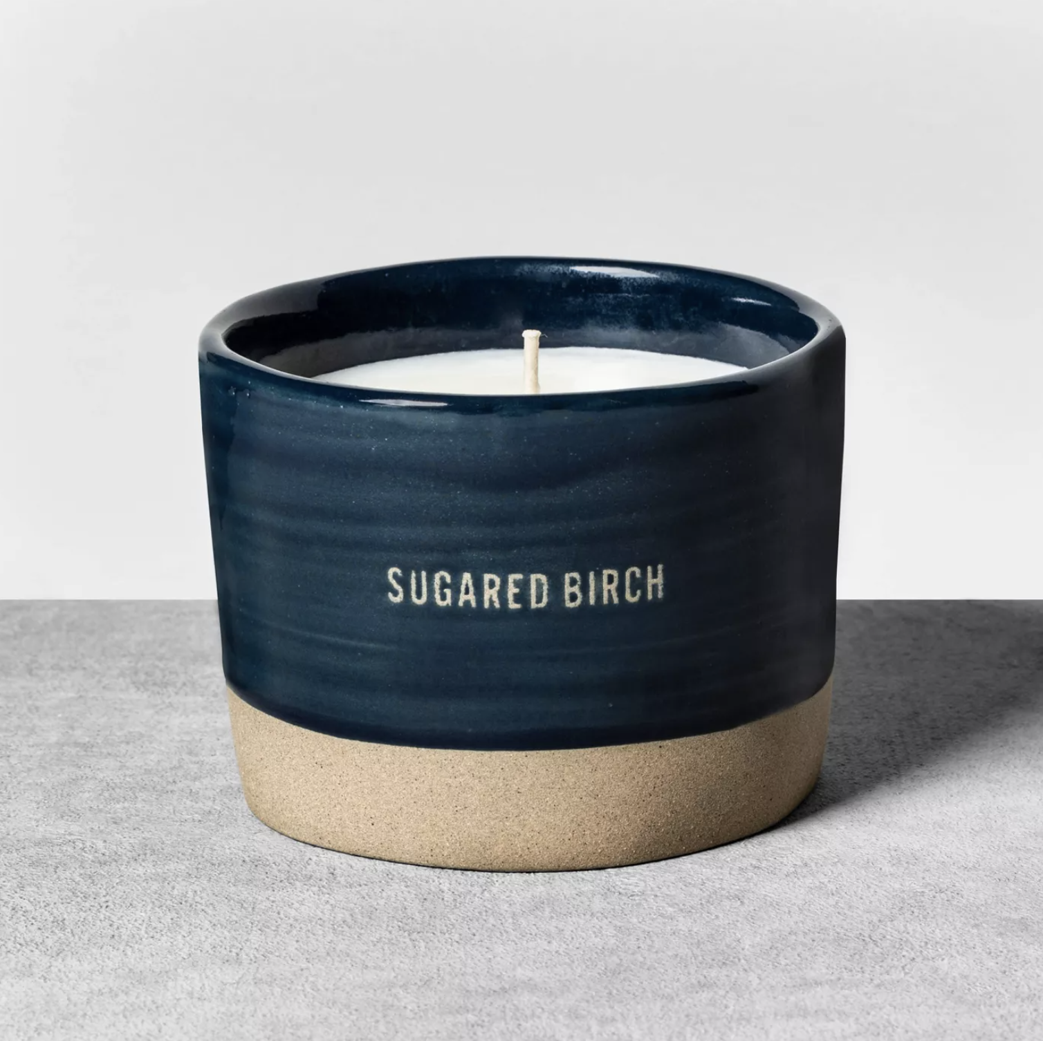 the navy blue candle that says sugared birch on the outside