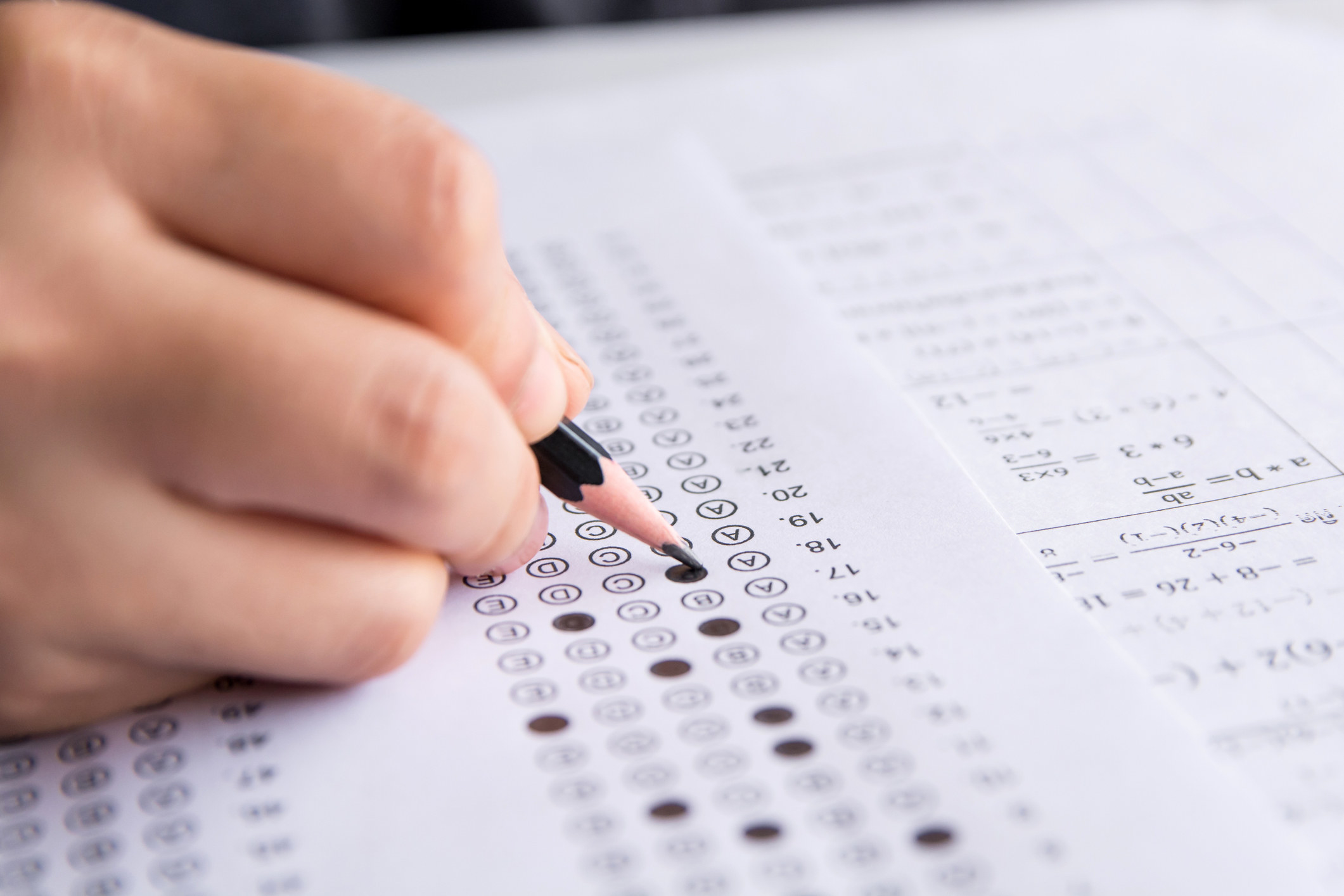 A student fills in answers for a multiple-choice exam