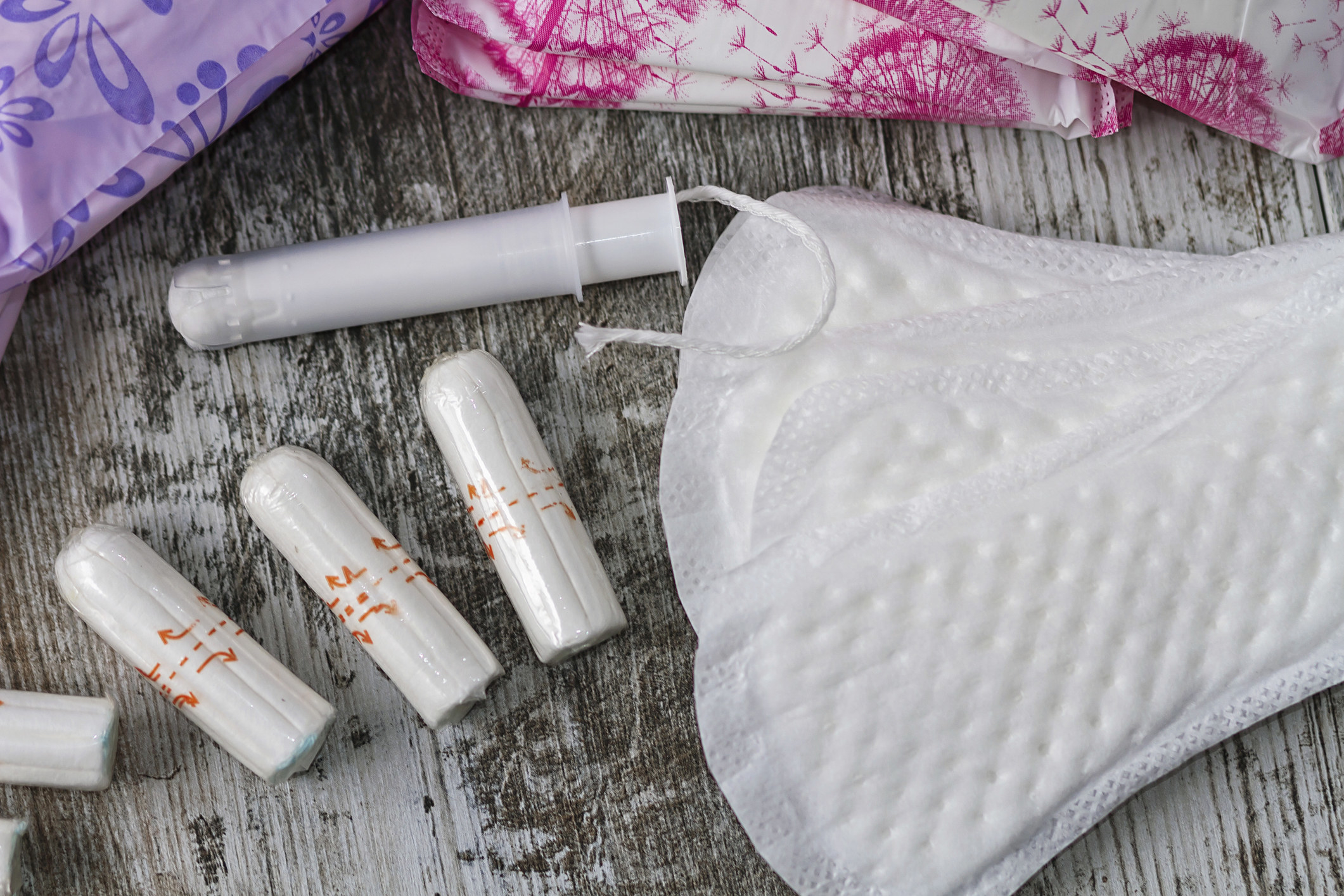 A collection of period products, including pads and tampons
