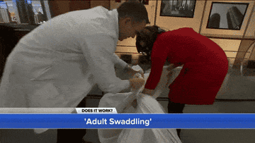 News anchors experiment with adult swaddling by tying up a person in a sheet