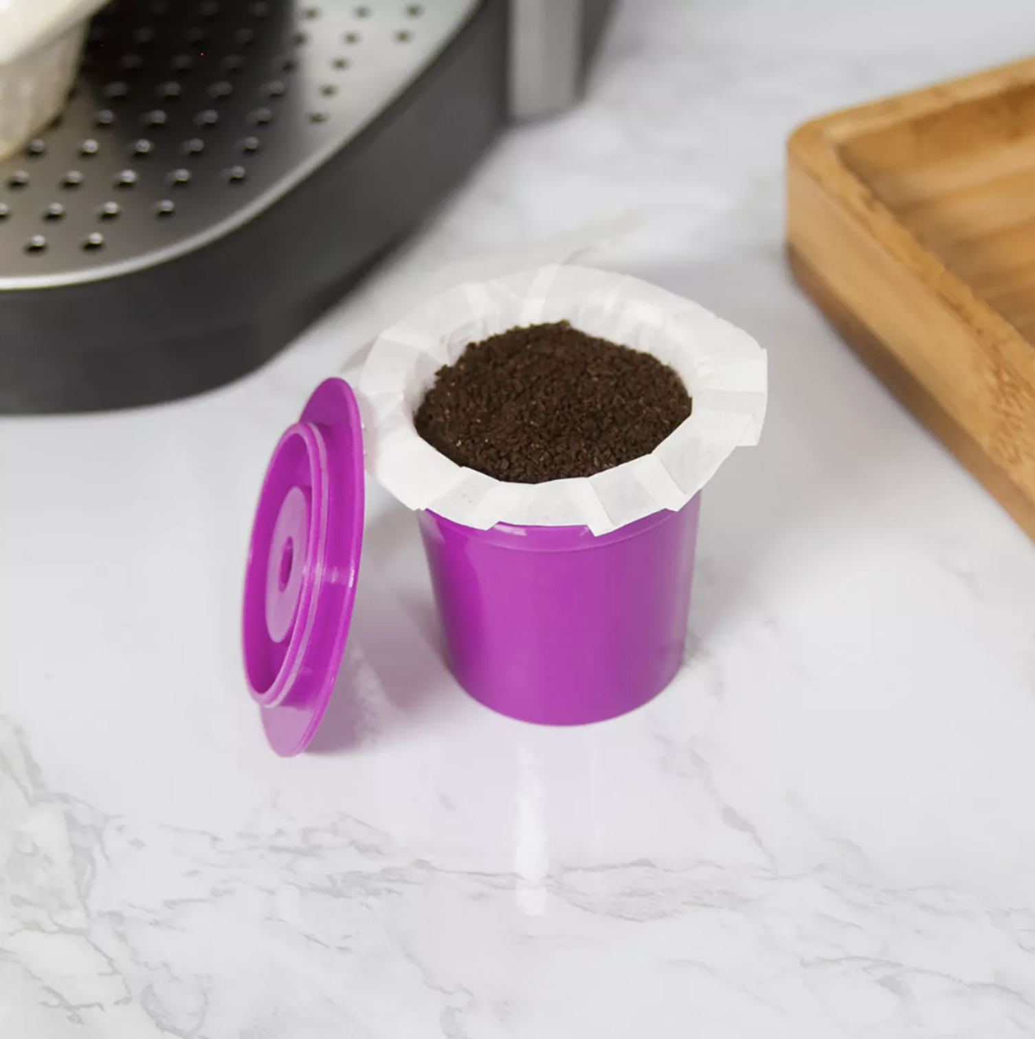 the purple single serve cup with a filter and coffee in it