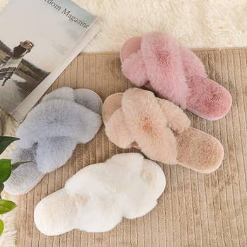 the fluffy criss-cross slippers in grey, cream, tan, and pink