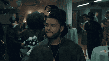 Abel looking smug and throwing a peace sign