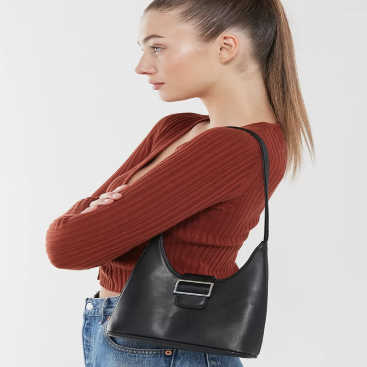 model holding the black bag