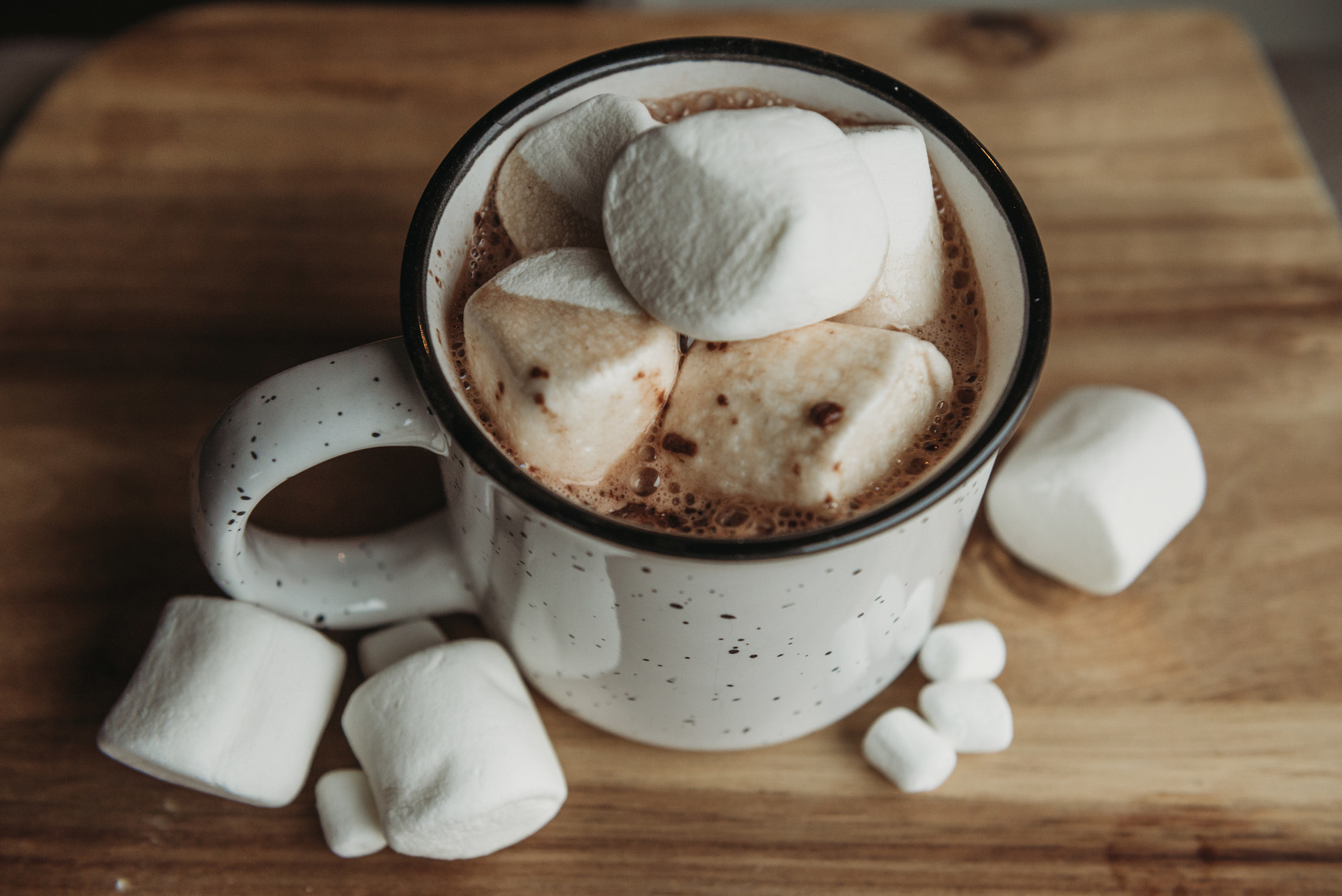 A cup of hot cocoa with marshmallows.