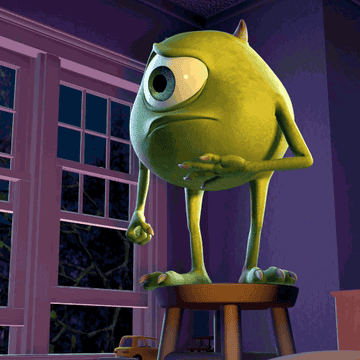 Mike Wazowski standing on a stool holding his belly and then closing his eyes and nodding while he hold 1 finger up. This is from the Monsters, Inc movie.