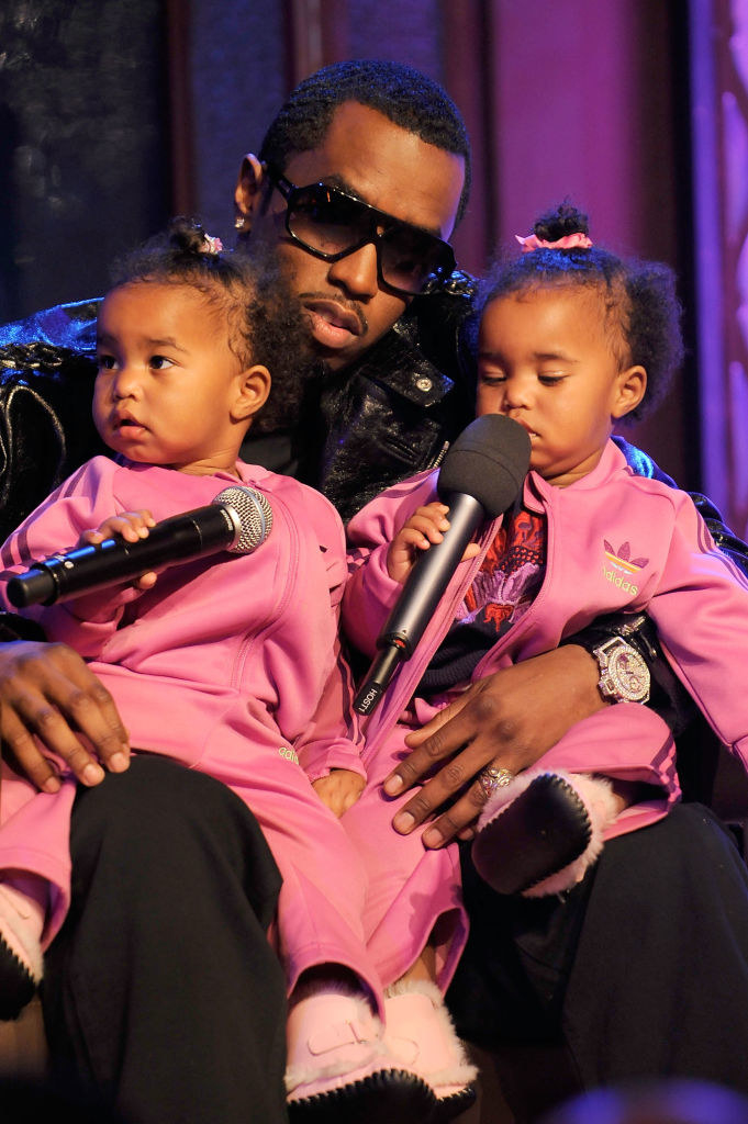 diddy holding his twins in 2008