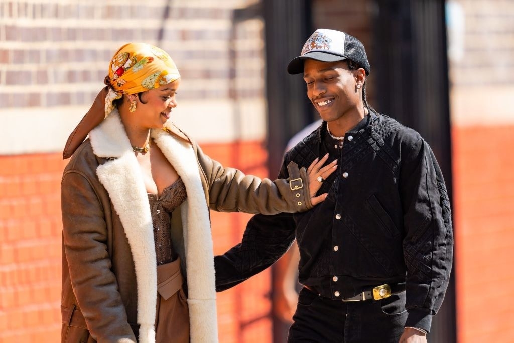 Rihanna wears a patterned head scarf, and Rocky has a ballcap