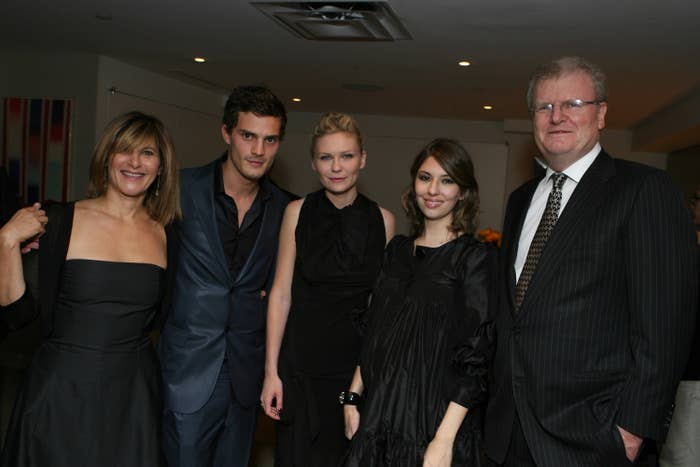 Jamie and Kirsten posing for a photo with Sophia Coppola and two other people