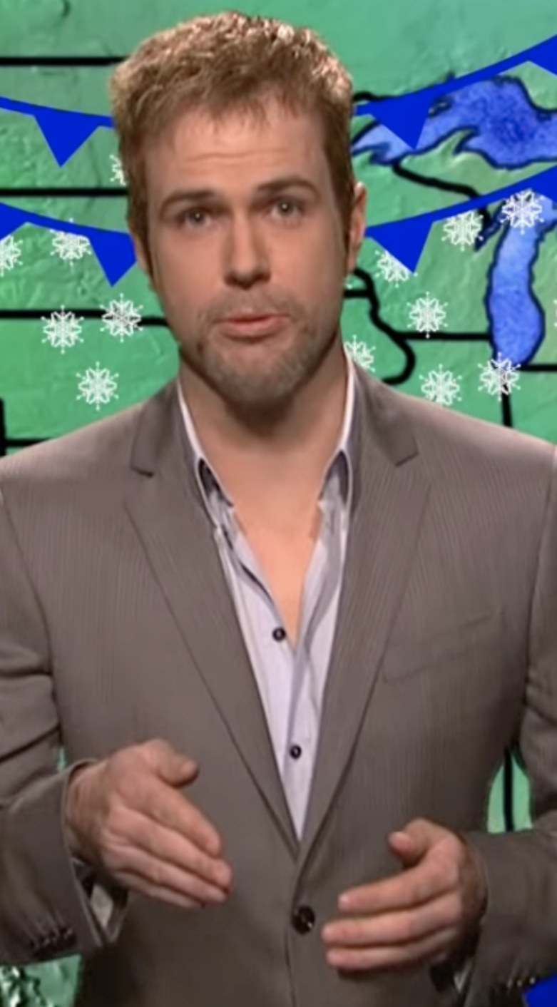 Killam impersonating Brad Pitt as a weather man in a suit