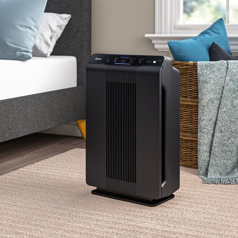 An image of a air purifier with four fan speeds, true HEPA filtration, and a carbon pre-filter