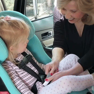GIF of model removing car seat buckle with the unbuckle me