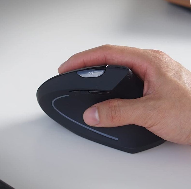 a person using the vertical computer mouse