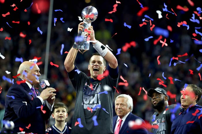 Tom Brady holds Super Bowl trophy