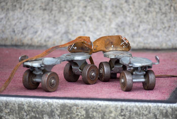 And old-fashioned pair of roller skates sitting on steps