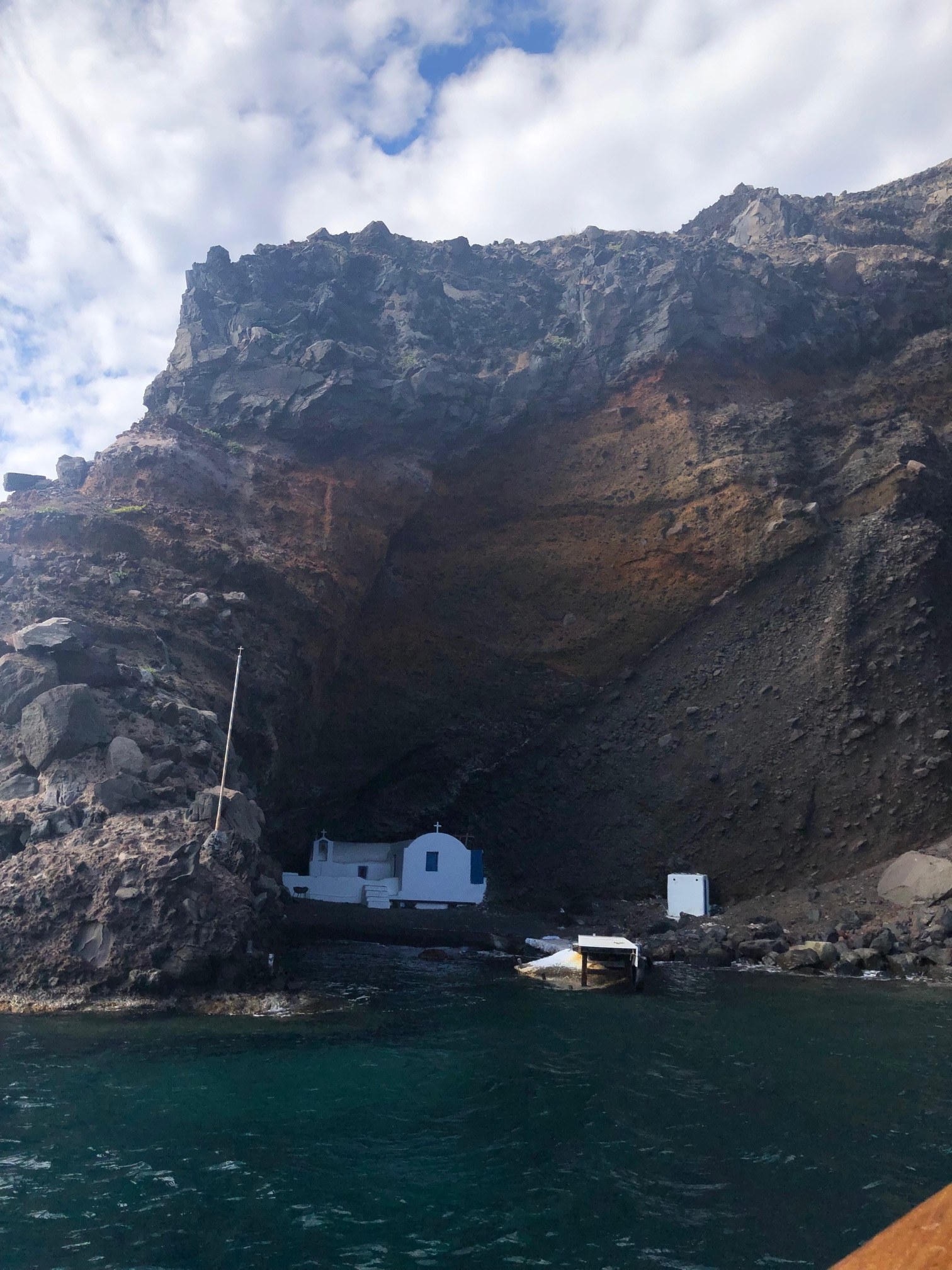 Church hidden in a nook in the volcanic rock