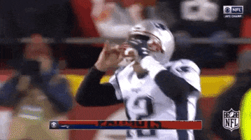 Tom Brady rips helmet off and celebrates with his teammates